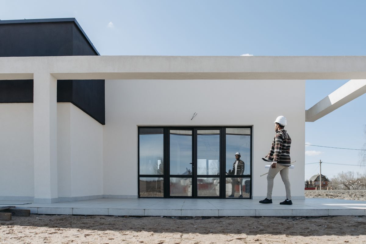Architect reviewing the plans of a real estate project funded through crowdlending